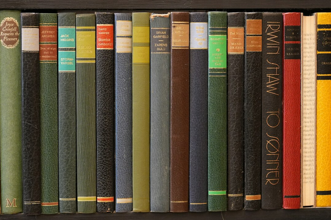 Colorful old books on a shelf