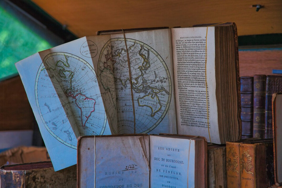 Old books and maps on a table
