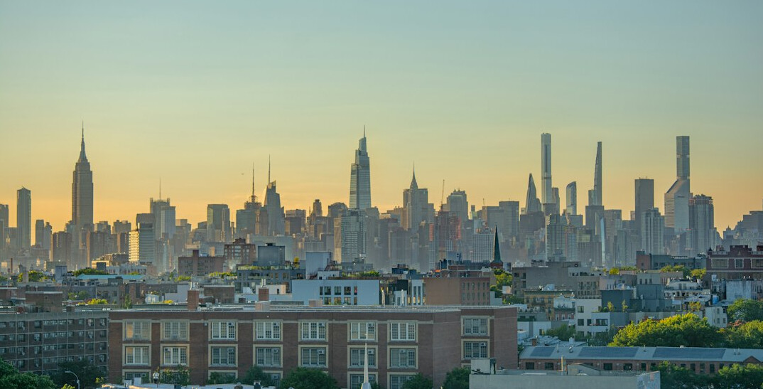 City skyline at dusk with historic buildings